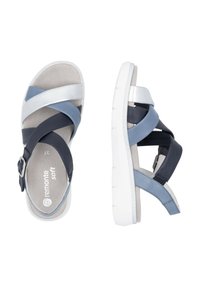 Blaue und dunkelblaue Leder-Sandalen mit überkreuzten Riemen, silbernen Akzenten und einer gepolsterten beigen Innensohle. Weiße Gummisohle mit strukturiertem Grip.