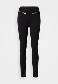 Leggings noirs en matière extensible, dotés de deux poches zippées avec des accents dorés à l'avant. Texture lisse et coupe ajustée.