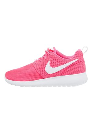 Pink mesh athletic shoe with white Nike swoosh, white sole, and laces, viewed from the side on a white background.