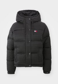 Black padded jacket with a hood, featuring a slight sheen, snap buttons, adjustable drawstring, and a small logo on the chest.