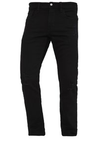 Jeans de mezclilla negra con un diseño ajustado, que presentan detalles desgastados, estilo de cinco bolsillos y cierre de botón.