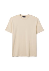 T-shirt in cotone beige con scollatura rotonda, maniche corte e vestibilità rilassata. Caratterizzato da una texture liscia e dettagli di cucitura sottili.
