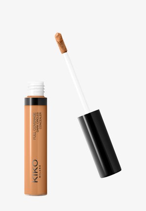 KIKO Full Coverage Dark Circles Concealer in a cylindrical, matte peach tube with a white applicator wand, featuring a textured tip.