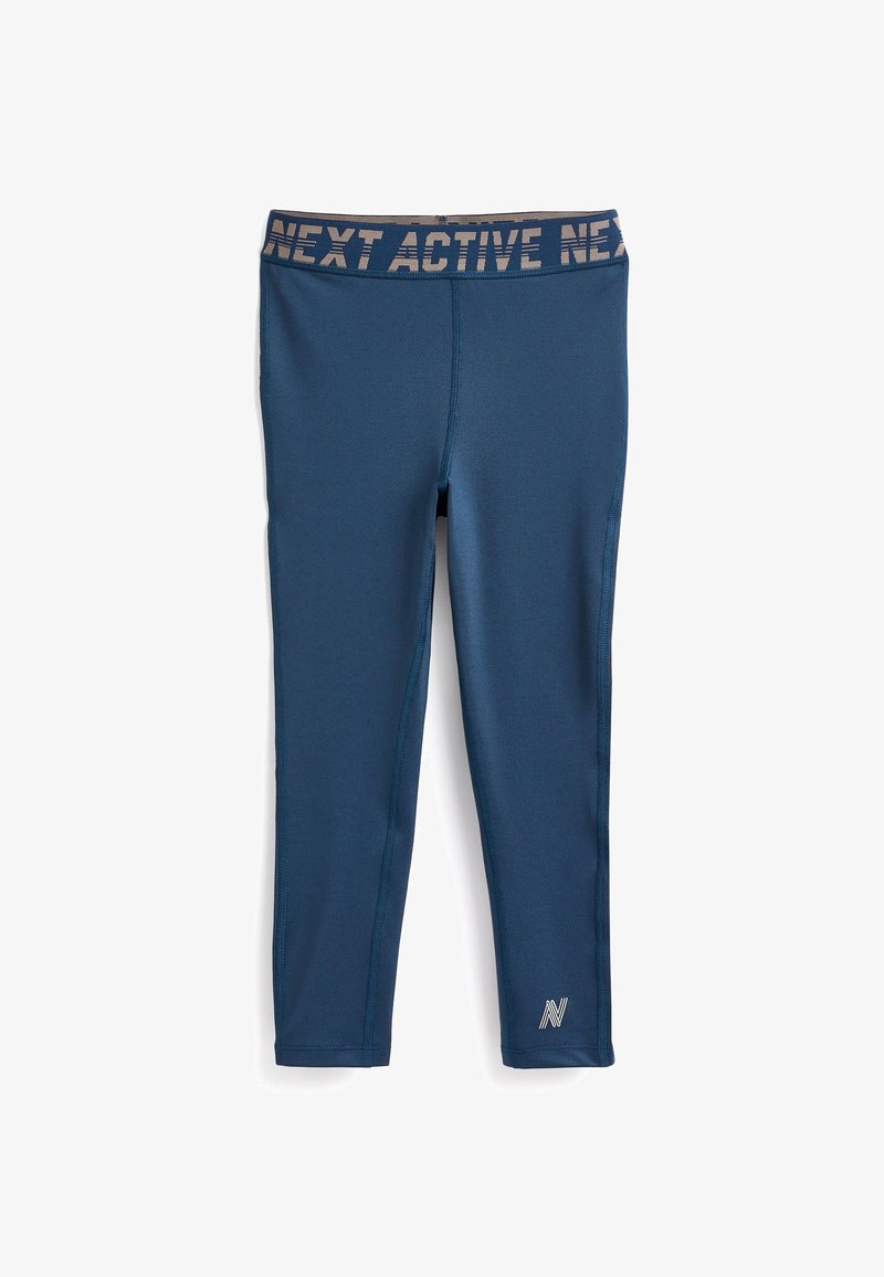 Leggings de sport navy avec une large ceinture imprimée. Fabriqués en matériau extensible ; texture lisse et design ajusté. Coutures latérales présentes.