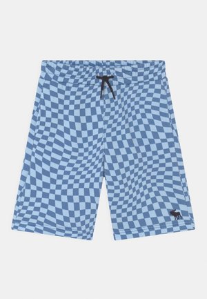 Pantalones cortos a cuadros azul y azul claro con patrón ondulado, cordón negro en la cintura elástica y pequeño logo de alce en la pierna izquierda.