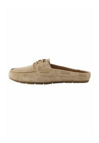 Beige suede slip-on shoe with a rounded toe, two eyelets, and a rubber sole. Features stitching detail along the edges.