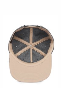 Cap with a beige brim and gray interior. Features stitched lining, ventilation holes, and an adjustable strap. Five-panel design.