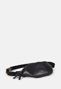 Black leather fanny pack with a smooth texture, gold zipper, and adjustable nylon strap; compact oval shape with minimal branding.