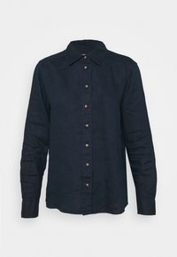Camicia di lino blu navy con chiusura frontale a bottoni, colletto e maniche lunghe, dotata di bottoni in bronzo lungo la patta e ai polsini.