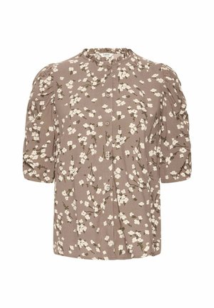 Blouse taupe à imprimé floral blanc, boutonnée devant, avec une encolure froncée et des manches bouffantes trois-quarts.