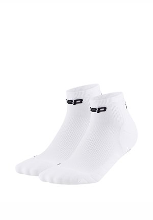 Pair of white ankle socks with ribbed texture and black logo text on the cuffs, shown against a plain white background.