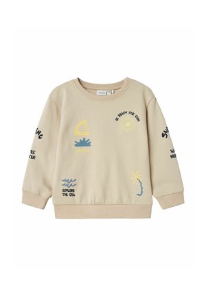 Jasno beżowy sweatshirt z kolorową haftowaną grafiką słońca, fal i palmy; ściągacze przy mankietach i u dołu, klasyczny dekolt.