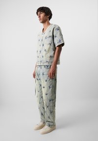 Don't Waste Culture SALEH UNISEX - Loose Jeans - pale