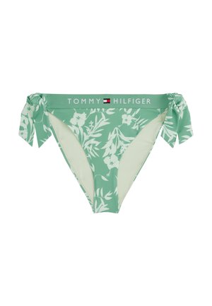 Bas de bikini vert menthe avec motif floral, liens sur les côtés et taille avec logo TOMMY HILFIGER. Texture lisse et design ajusté.