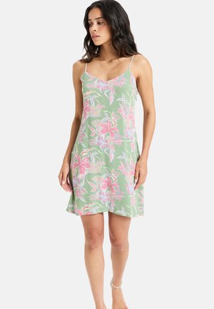 Light green floral dress with thin spaghetti straps, featuring pink and blue floral patterns, a flared hem, and soft, lightweight fabric.