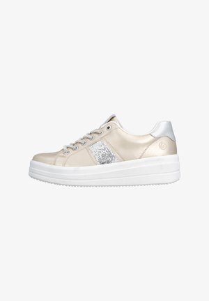 Beige low-top sneaker with white platform sole, silver eyelets, silver glitter stripe on side, and metallic silver heel tab.