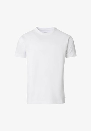 T-shirt blanc à manches courtes en coton avec un col rond et un ourlet droit. Présente une petite étiquette de marque sur le côté.
