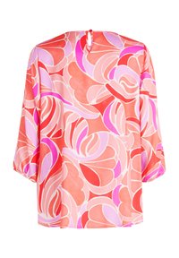 Blusa fluida con motivo floreale, caratterizzata da tonalità di rosso, rosa e viola. Maniche larghe e dettaglio a chiave sullo scollo. Tessuto morbido.