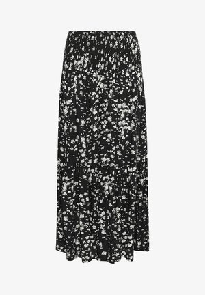 Svart kjol med smockad topp och flödande, lagerdesign. Har ett vitt blommönster över hela tyget. Lättviktig textur.