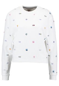 Vit sweatshirt med långa ärmar, prydd med flerfärgade broderade bokstäver och rektangulära mönster utspridda över tyget.