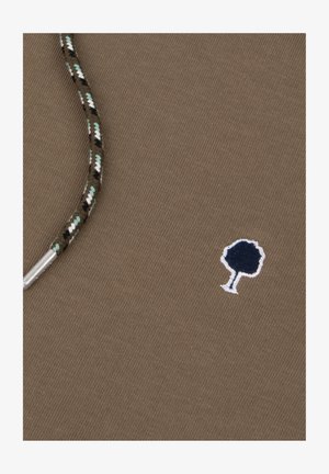Brown fabric with a textured weave, featuring a small navy tree embroidery and a patterned cord with green, black, and white accents.