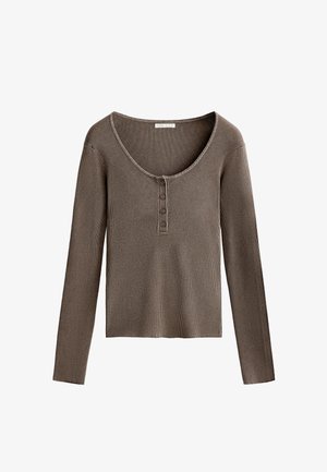 Rjava rebrasta dolga majica z širokim krojem in tri gumbi na prsih. Mehka tekstura in prilegajoča zasnova.