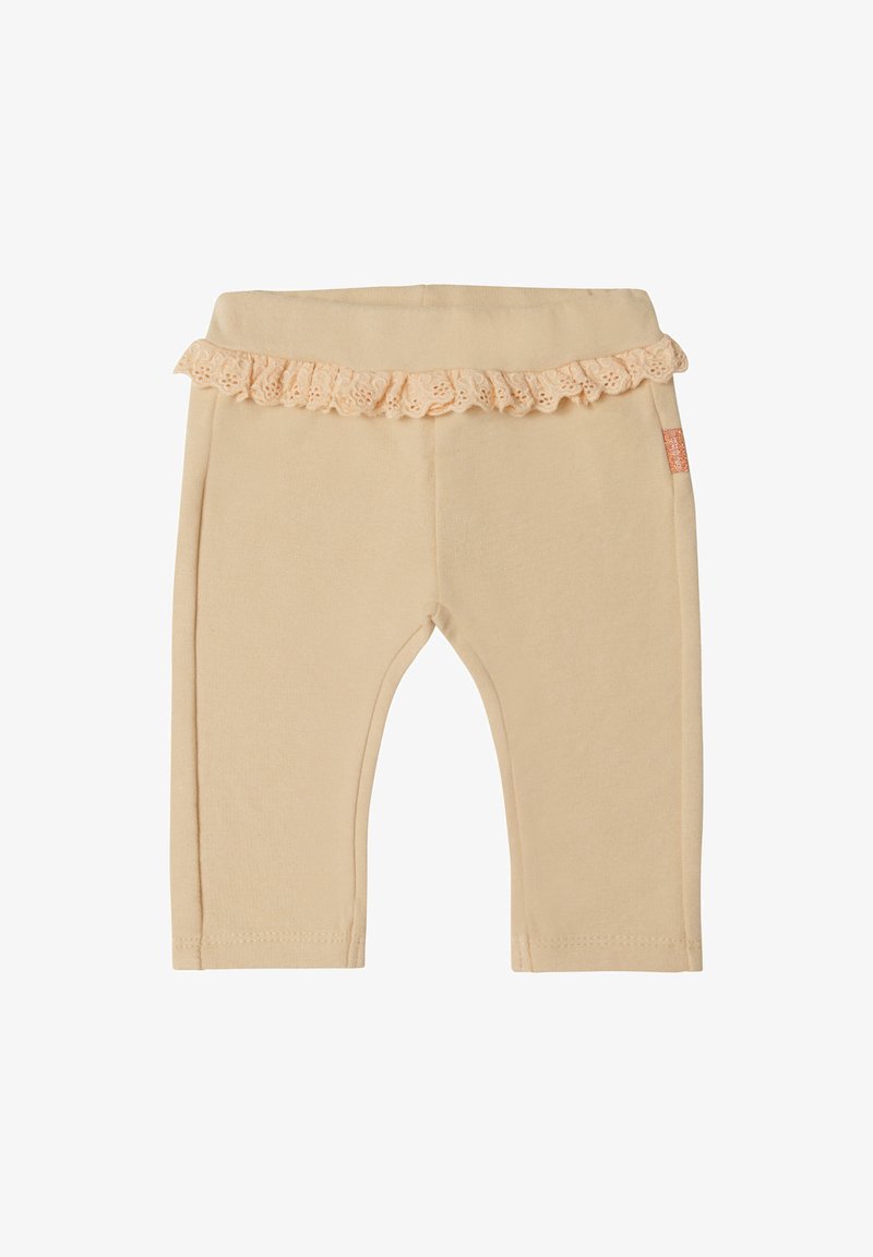 Beżowe legginsy bawełniane z falbaną koronkową w pasie, o dopasowanym kroju i prostych nogawkach. Zawierają małą metkę marki z boku.