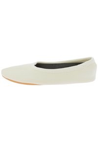 Ballet flat shoe in off-white canvas with a smooth texture, rounded toe, and flexible tan rubber sole. Simple design with no embellishments.