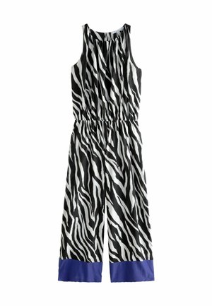 Fekete-fehér zebra csíkos overall, redőzött nyakkivágással, elasztikus derékkal és kék selyem mandzsettával a bokán. Puha szövettextúra.