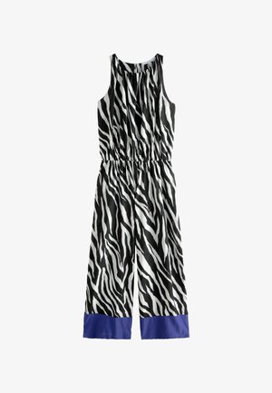 Mustvalge zebrariibuline jumpsuit, millel on gathered kaelus, elastne vöökoht ja sinised satiinistsenad pahkluu juures. Pehme kangastekstuuri.