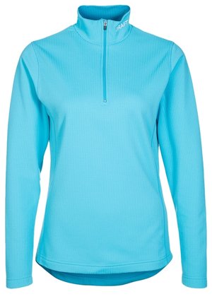 Lichtblauwe atletische pullover met lange mouwen, een kwart ritssluiting en een hoge kraag, gestructureerde stof en het "CRAFT"-logo op de kraag.