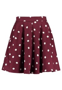 Mörkröd kjol med en veckad design, prydd med vita prickar. Tillverkad av ett mjukt tyg har den ett figursytt midjeband och en utsvängd nederkant.