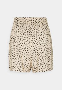 Béžové kraťasy s černým nepravidelným tečkovaným vzorem a elastickým pasem, vystavené na jednoduchém bílém pozadí.