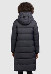Long, padded black winter coat featuring a hood, horizontal quilted design, and a logo accent on the back. Smooth texture and knee-length silhouette.