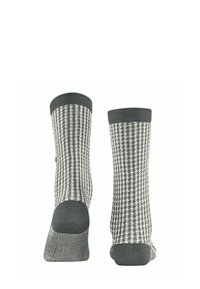 Calze grigie e crema con un motivo a pied-de-poule, caratterizzate da una texture a coste e sezioni del risvolto e del tallone di un colore uniforme a contrasto.