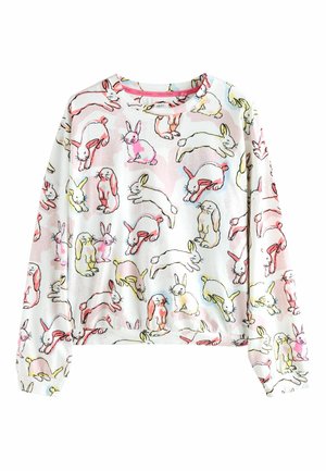 Biała bluza z nadrukiem zabawnych króliczków w kolorach różowym, żółtym i czarnym, z okrągłym dekoltem i długimi rękawami. Miękka faktura tkaniny.