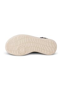 Gummisula till sneakers, strukturerad med spår och mönster. Krämfärg kontrasterar med mörkare övre material (inte synligt). Storlek markerad som 37.