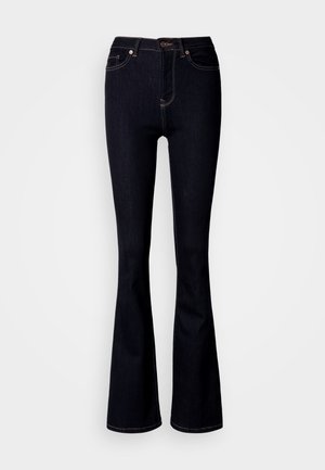 Temno modre zvončaste kavbojke iz jeansa. Ponašajo se z visokim pasom, petimi žepi in kontrastnim šivom. Gladek tekstura z nežnim sijajem.