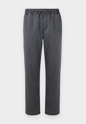 Pantalons gris amples en coton, dotés d'une taille élastique avec cordon de serrage, de jambes droites et sans poches.