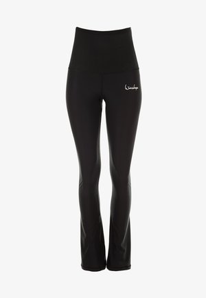 Czarne legginsy z wysokim stanem, wykonane z elastycznego materiału, o rozszerzanym kroju i małym białym logo na lewym biodrze.