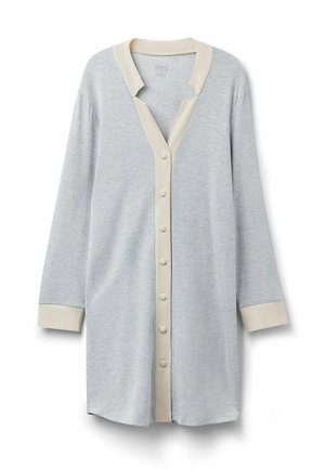 Ljusgrå cardigan med långa ärmar, V-ringning och krämfärgad kant. Har en rad knäppningar fram och kontrasterande mudd.
