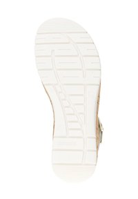 White rubber outsole with textured grip pattern; tan cork side detailing and metallic buckle accents visible on the heel area.