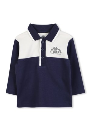 Polo-shirt à manches longues bleu marine avec col blanc, trois boutons et logo brodé "Timberland 1973 New England" sur le devant.