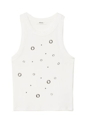Valkoinen hihaton crop-top, jossa on edessä vaihtelevan kokoisia metallisia niittejä koristeluna.