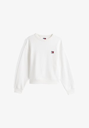 Balta sportinė maikutė su apvalia iškirpte, su guminėmis rankovėmis ir apačia. Krūtinėje yra mažas logotipo užsiuvimas raudona, balta ir mėlyna spalvomis. Pagaminta iš minkštos medžiagos.