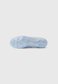 Sleek football cleat sole in translucent blue plastic with nine distinct studs, featuring smooth curves and a central Nike emblem.