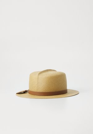 Straw fedora hat with a wide brim, beige color, featuring a brown leather band. Textured weave design enhances the overall structure.
