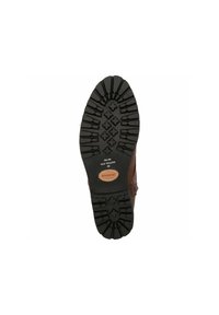 Suola di scarpa in cuoio marrone con profonde scanalature e un motivo distintivo. Presenta una base in gomma nera testurizzata e una patch logo color tan.