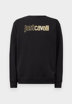 Juodas ilgomis rankovėmis džemperis su auksiniu "Just Cavalli" logotipu per krūtinę, su gumuotais rankogaliais ir apačia.