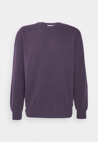 Fioletowa bluza crewneck wykonana z bawełny, z długimi rękawami i ściągaczami na rękawach. Subtelne logo wyhaftowane na piersi. Gładka faktura.